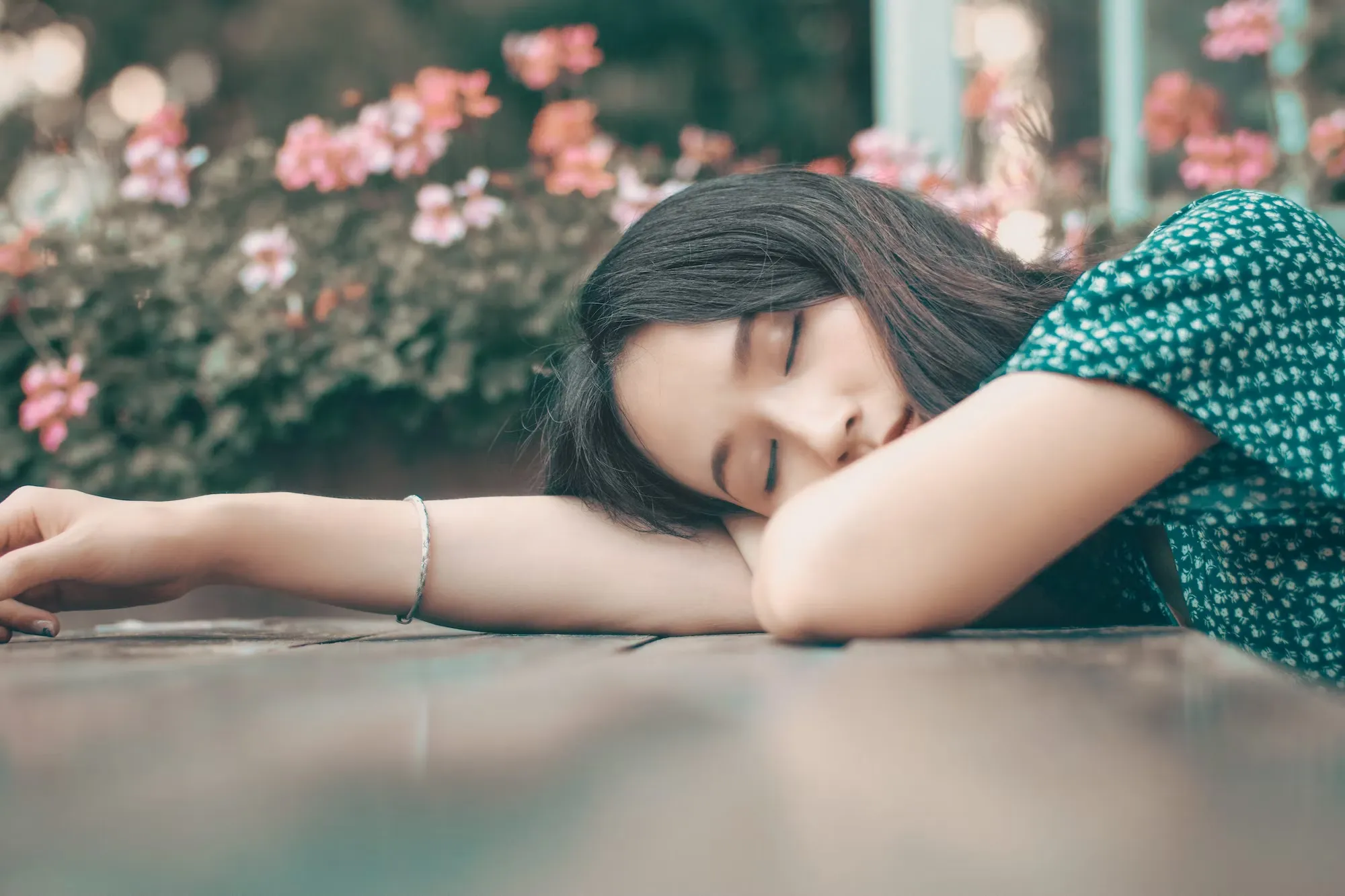 

The image shows a person lying down on a couch, taking a nap in the middle of the day. The image illustrates the article by showing the positive side of napping during the day, providing a moment of rest and relaxation.